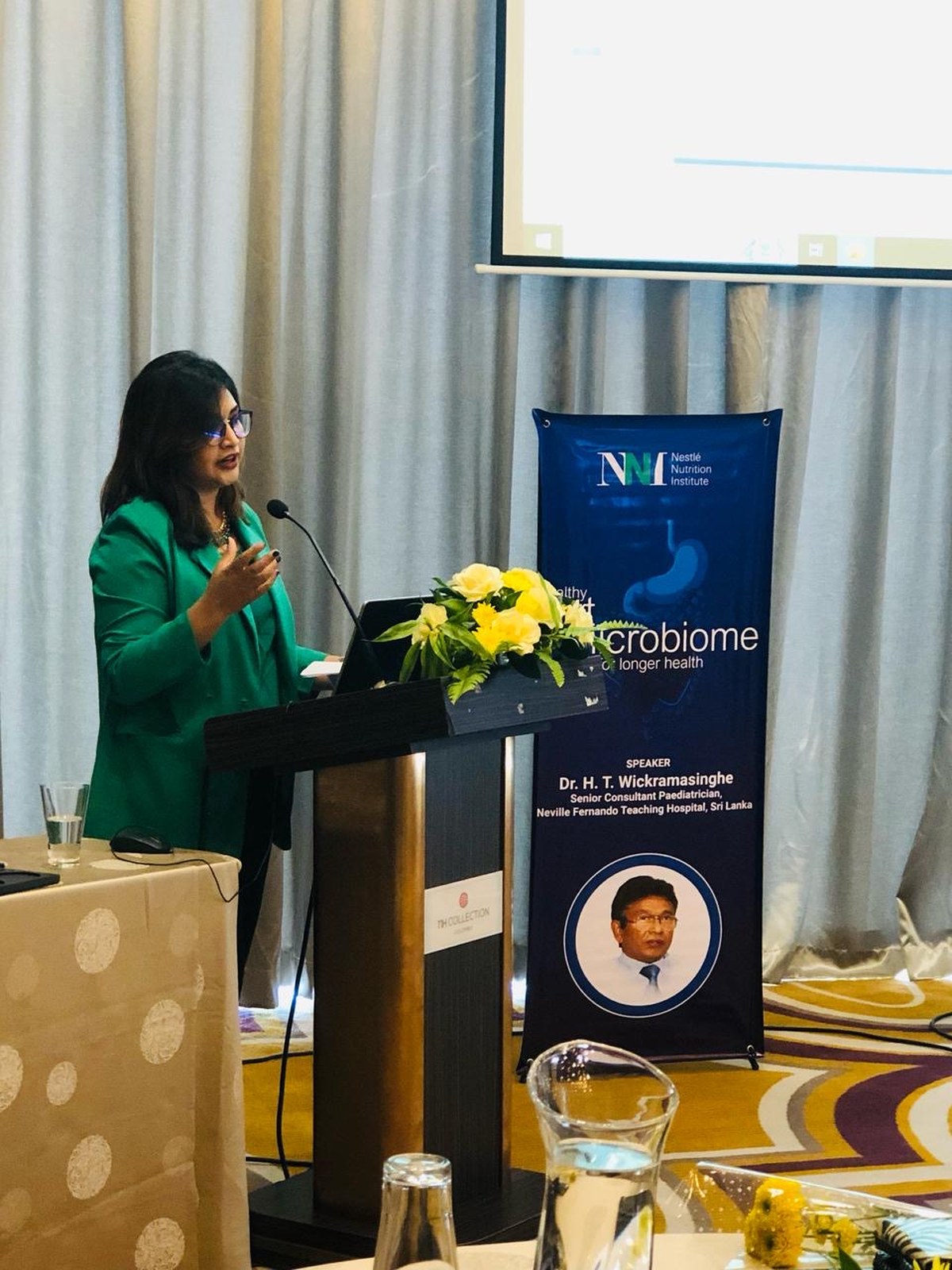 Guest speaker presenting at an international medical conference in Sri Lanka, corporate meeting and seminar organized as part of a MICE event