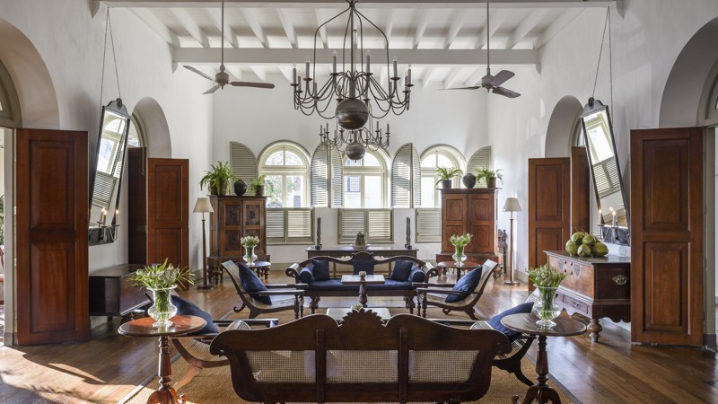 Amangalla heritage hotel interior in Galle Fort Sri Lanka with colonial architecture, high ceilings, antique furniture and elegant lounge setting