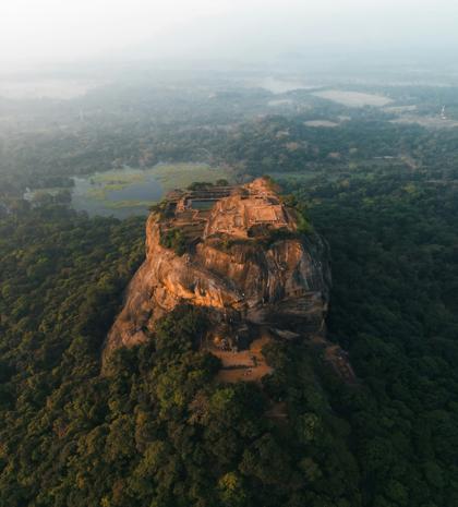 Sigiriya Rock Fortress aerial view surrounded by lush jungle in Sri Lanka
