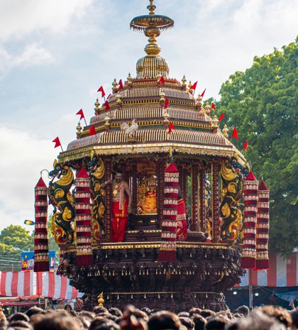 Traditional Sri Lankan temple chariot procession with ornate decorations and devotees